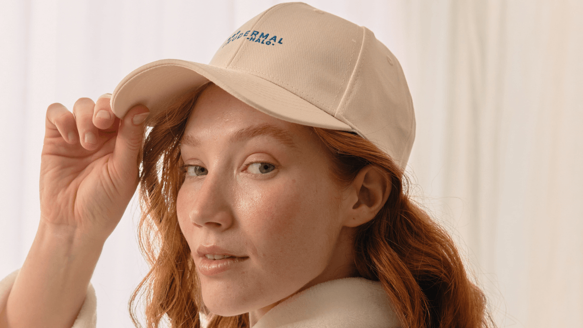 Girl wearing hair growth cap