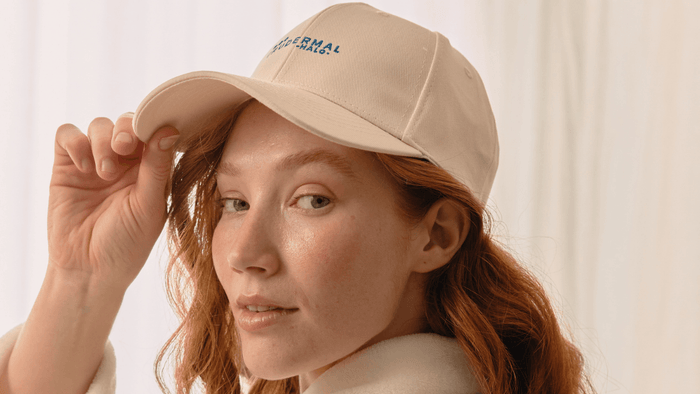 Girl wearing hair growth cap