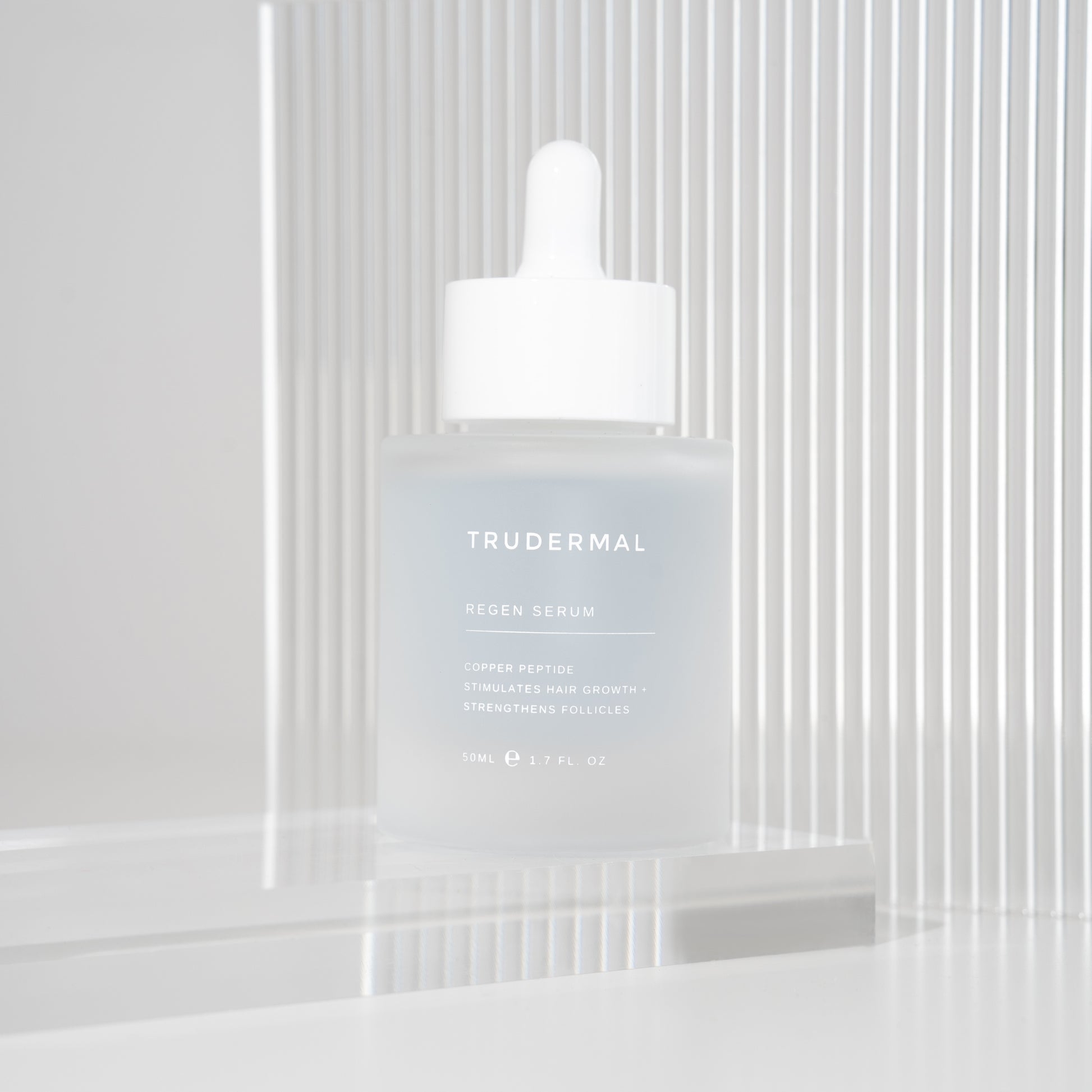 Trudermal Regen hair growth serum designed to strengthen strands and improve hair density.